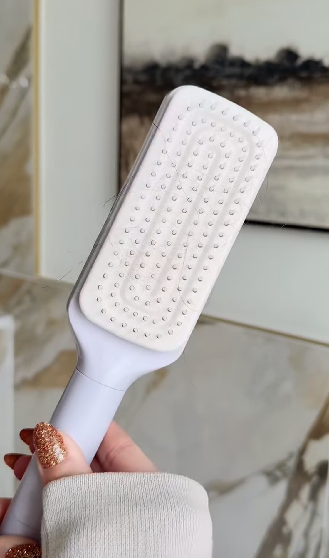 Fribrush brush on a bright bathroom counter